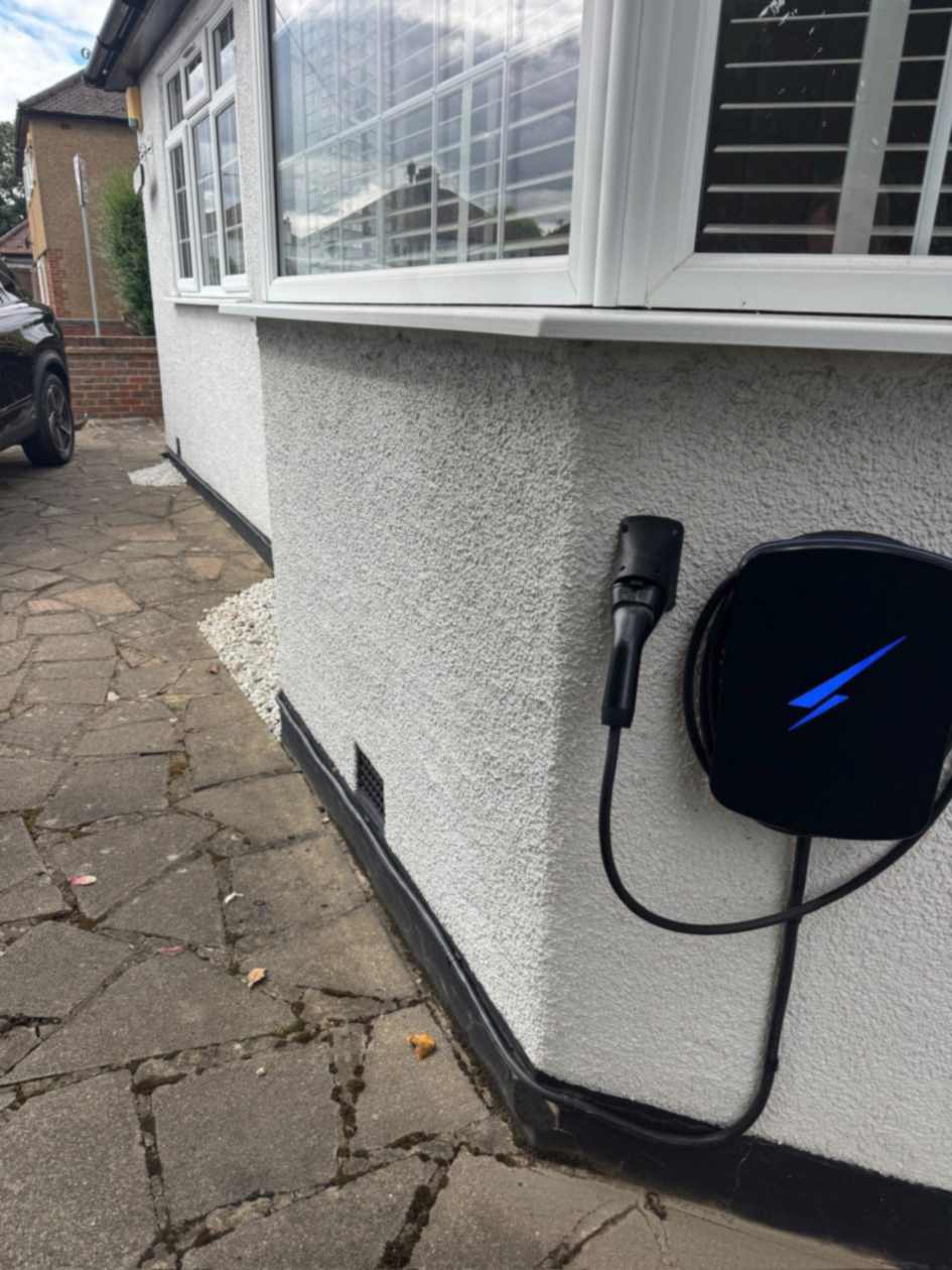Hypervolt charge point on the side wall of a South Ruislip bungalow, with the driveway and car in view.