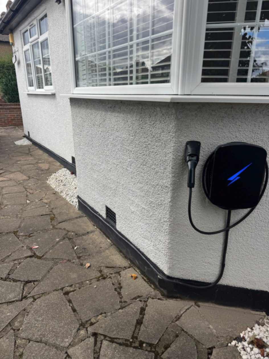 Hypervolt charge point installed below a bay window on a white rendered bungalow in South Ruislip.
